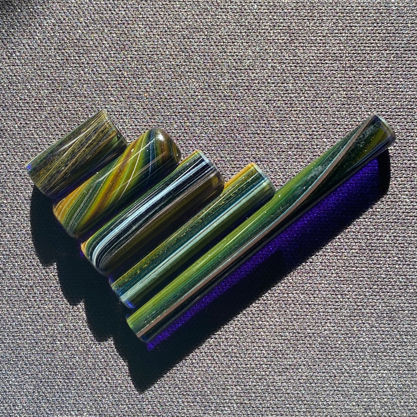 Handblown glass slurper pillars in multiple sizes with space-themed galaxy design