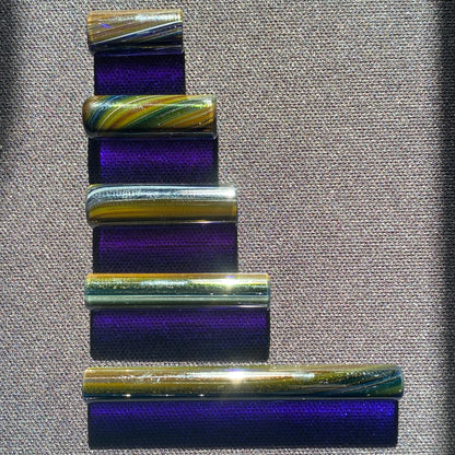 Close-up of handblown glass slurper pillar showing galaxy sparkle and flat lapped ends